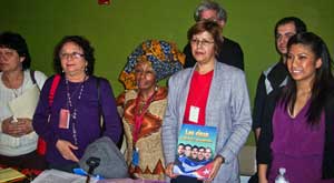 Maritzel  González-Quevido holds picture of<br>Cuban Five political prisoners at discussion<br>of women’s status at UN. 