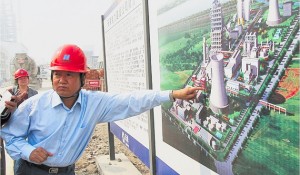 China in 2010 became the world’s largest investor in clean energy. It is the largest producerof solar panels and of wind energy. Here, an engineer points to a diagram of the GreenGencoal-fired, low-emission power plant that went online this year.