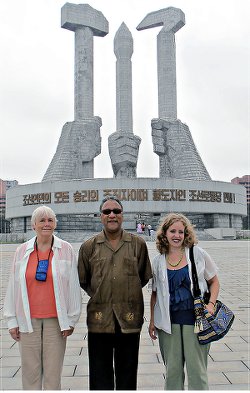 WWP delegation, Deirdre Griswold, Larry Holmes, Elena Gilbert, at the Workers’ Party of Korea monument.