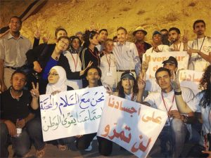 Anti-war delegation from U.S. meet with Syrian youth at their ‘Over Our Dead Bodies’ encampment on Mount Qasioun outside Damascus  These youth have pledged to resist any imperialist attack on Syria. U.S. delegates are Ramsey Clark,  Cynthia McKinney, John Parker, Sara Flounders, Dedon Kamathi and Johnny Achi.