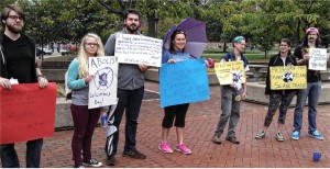 Protesters at Marshall University denounce Columbus, Oct. 14.