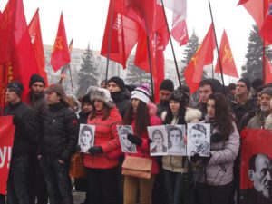 Young communists in Kiev carry photos of Komsomol resistance fighters executed by Nazis in occupied Ukraine 71 years before, on Feb. 8, 1943.