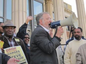 Andre Francois, left, and Steve Kirschbaum (with bullhorn) at Sept. 15 rally. Both were illegally fired by Veolia.Photo: Howard Rotman
