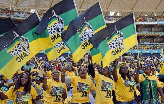 Supporters of the African National Congress (ANC) cheer during their party's final election rally in Soweto. 