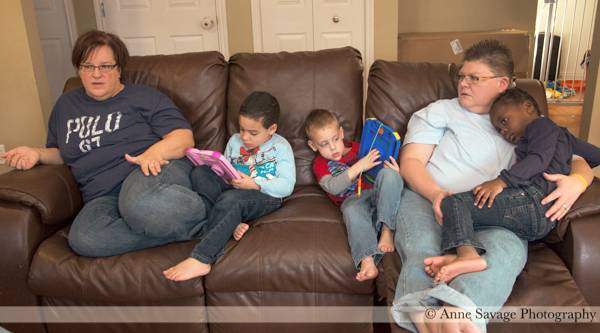 Nurses April DeBoer and Jayne Rowse at home in Michigan with three of their five dopted children.
