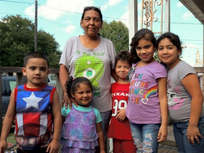 Paula and her family on the porch across from the Valero “toxic waste” refinery.