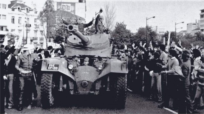 People cheer troops who turned their guns around after refusing to fight for the Portuguese fascist dictatorship against the liberation struggles in Africa.