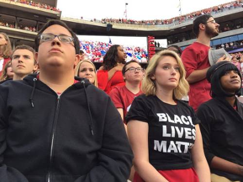 Students refuse to stand during national anthem at first-ranked University of Alabama football game. Tuscaloosa, Oct. 1.