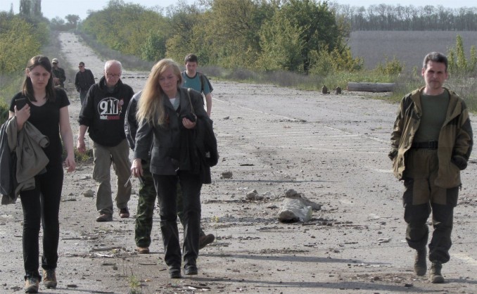 Ghost Brigade Commander Alexey Markov (right) gives international visitors a tour of the front line near Kirovsk, LPR.