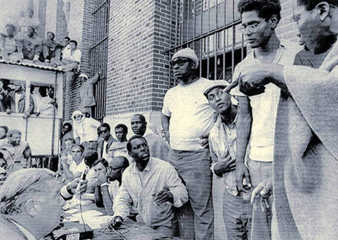 Attica prison inmates negotiate with Commissioner Russell Oswald, lower left.