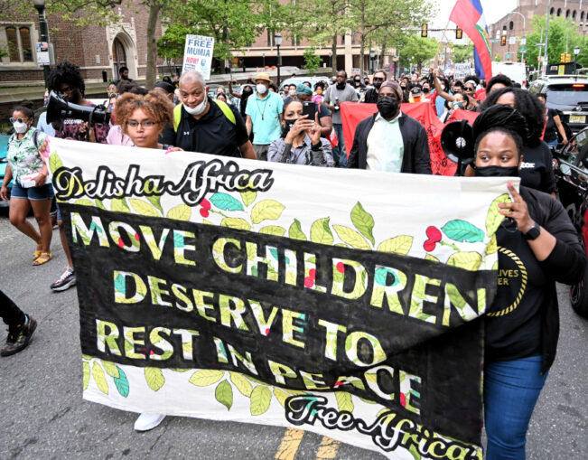 Rally demands: MOVE children deserve to rest in peace