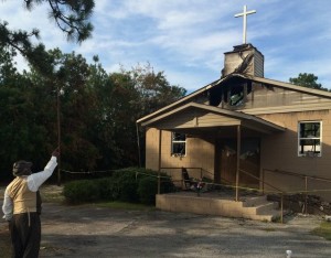 Pastor Bobby Jones outside torched church in Warrenville, S.C. 