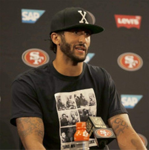 Wearing a shirt showing the 1960 meeting between Fidel Castro, and Malcolm X in Harlem, Colin Kaepernick speaks at press conference on his refusal to stand for the U.S. national anthem, Aug. 26.