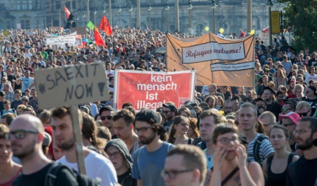 5,000 demonstrate in Dresden, Germany, on Aug. 29 in solidarity with migrants. Sign in center reads: ‘No human being is illegal.’