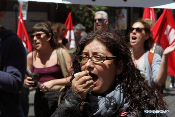 A protester chants slogans during a demonstration in Athens, Greece, on May 6, 2016. 