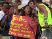 Sign reads Tito Arias (war pseudonym for the current president) -- remember how many he killed and ordered killed.