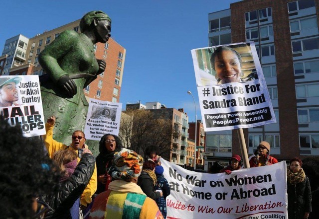 Celebrating International Women’s Day in Harlem, N.Y. at a statue of Harriet Tubman, the amazing Civil War hero who helped hundreds escape slavery. They then marched to spotlight the many issues women face today.WW photo: Brenda Ryan