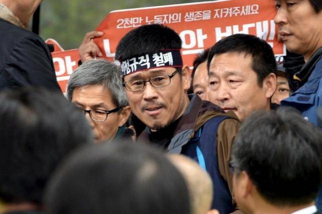 Han Sang-Gyun, the head of the Korean Confederation of Trade Unions (KCTU), surrenders voluntarily to the police in Seoul, Dec. 10.