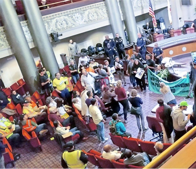 Protesters at Oakland City Council demand a moratorium on evictions.WW photo: Terri Kay