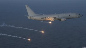 U.S. Navy's P-8 Poseidon surveillance jet launches flares over the Pacific.