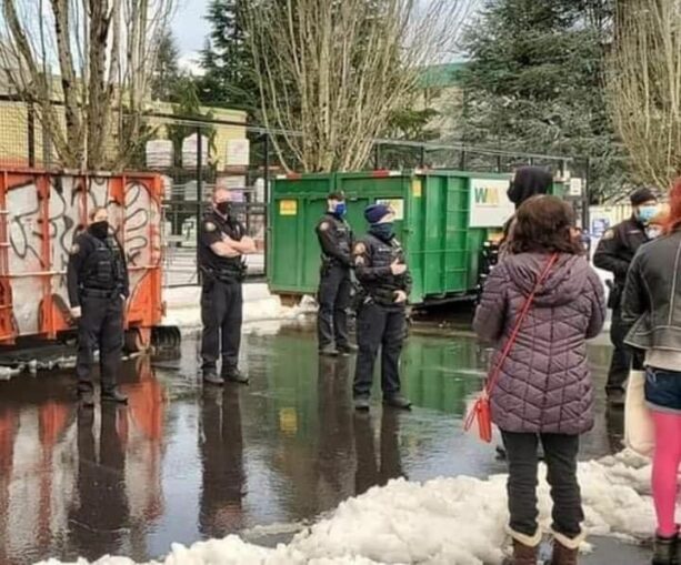 Portland, Ore. — Police stop hungry people from retrieving food from dumpster