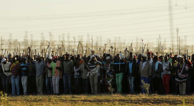 Miners on strike chant slogans as they march in Nkaneng township outside the Lonmin mine in Rustenburg