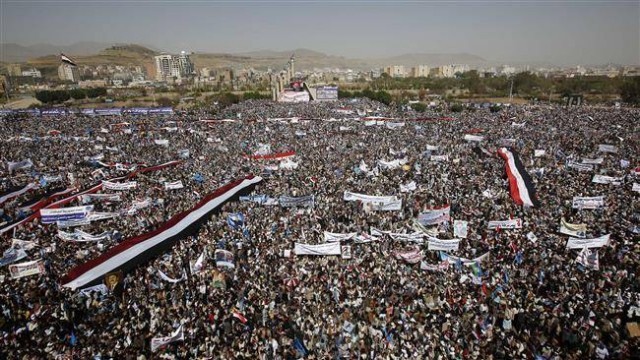 Yemeni people attend a rally marking first anniversary of Saudi Arabia’s war of aggression against the country in the capital, Sana’a, March 26.